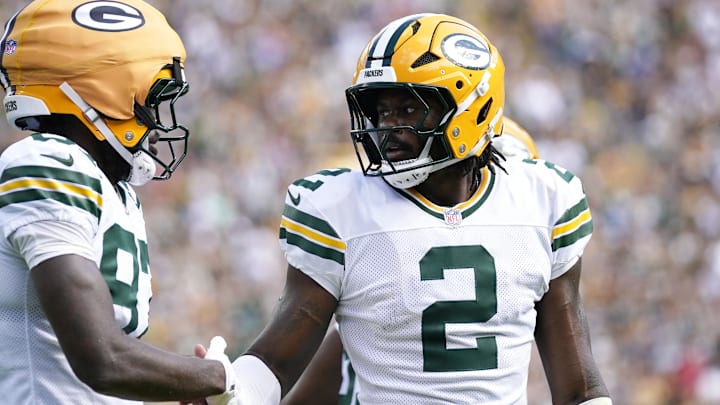 Aug 23, 2025; Green Bay, Wisconsin, USA; Green Bay Packers quarterback Malik Willis (2) celebrates a touchdown scored by Green Bay Packers wide receiver Romeo Doubs (87) during the first half at Lambeau Field. Mandatory Credit: Kayla Wolf-Imagn Images