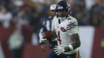 Oct 13, 2025; Landover, Maryland, USA; Chicago Bears running back D'Andre Swift (4) runs with the ball against the Washington Commanders during the fourth quarter at Northwest Stadium.