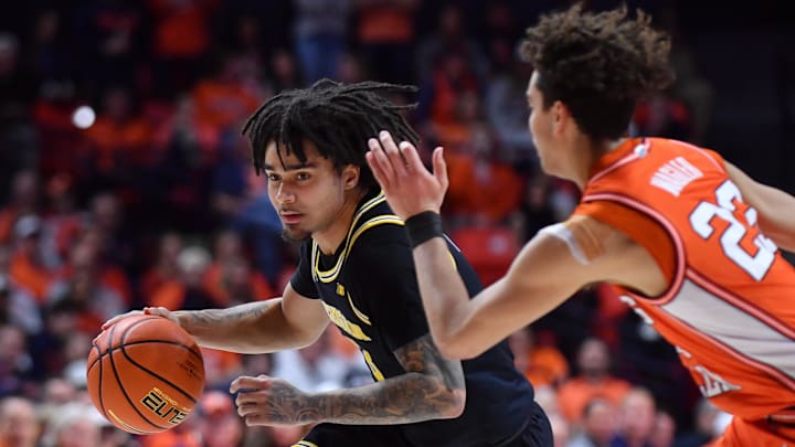 Feb 27, 2026; Champaign, Illinois, USA;  Michigan Wolverines guard Elliot Cadeau (3) drives the ball against Illinois Fighting Illini guard Keaton Wagler (23) during the second half at State Farm Center. Mandatory Credit: Ron Johnson-Imagn Images