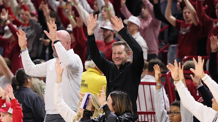Dec 29, 2025; Fayetteville, Arkansas, USA; Arkansas Razorbacks head coach Ryan Silverfield “Calls the Hogs” during the second half against the James Madison Dukes at Bud Walton Arena. Arkansas won 103-74. Mandatory Credit: Nelson Chenault-Imagn Images