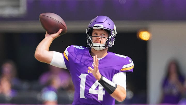 Aug 10, 2024; Minneapolis, Minnesota, USA; Minnesota Vikings quarterback Sam Darnold (14) passes against the Las Vegas Raiders in the first quarter at U.S. Bank Stadium.  