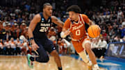 Xavier's Dayvion McKnight pressures Texas' Jordan Pope during the Xavier vs. Texas NCAA Tournament First Four game in Dayton on March 19, 2015.