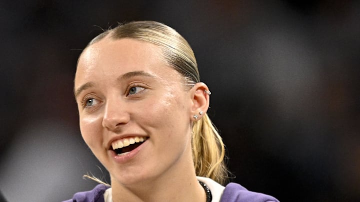 Dallas Mavericks guard Kyrie Irving talks with Dallas Wings guard Paige Bueckers. Dallas Mavericks guard Kyrie Irving talks with Dallas Wings guard Paige Bueckers.