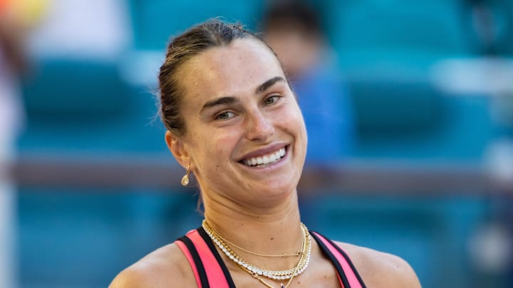Aryna Sabalenka poses after a match