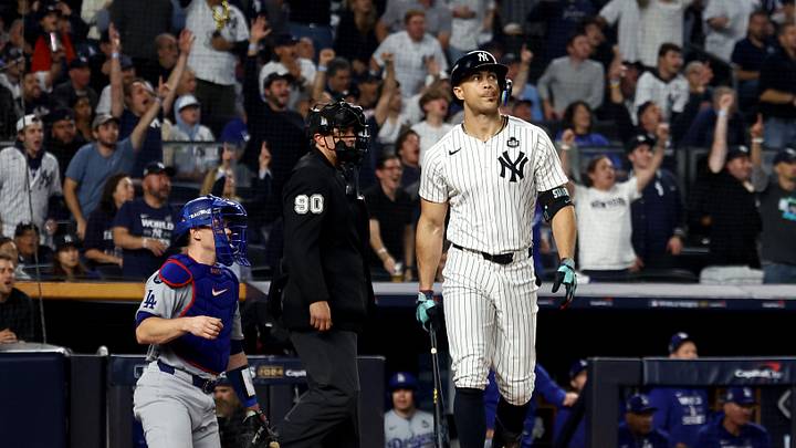 Oct 30, 2024; New York, New York, USA; New York Yankees designated hitter Giancarlo Stanton (27) reacts after hitting a home run during the third inning against the Los Angeles Dodgers in game five of the 2024 MLB World Series at Yankee Stadium. Mandatory Credit: Vincent Carchietta-Imagn Images
