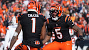 Cincinnati Bengals wide receivers Ja'Marr Chase and Tee Higgins (5) celebrate against the Cleveland Browns.