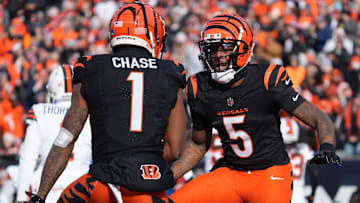 Cincinnati Bengals wide receivers Ja'Marr Chase and Tee Higgins (5) celebrate against the Cleveland Browns.