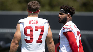 San Francisco 49ers defensive end Nick Bosa (97) chats up new teammate Bryce Huff (47) during an OTA at Levi's Stadium.