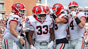 Georgia Bulldogs running back Chauncey Bowens (33) reacts after a touchdown against the Mississippi State Bulldogs during the first half at Davis Wade Stadium at Scott Field.