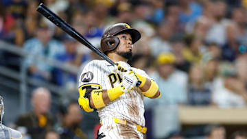 Sep 23, 2025; San Diego, California, USA; San Diego Padres designated hitter Luis Arraez (4) hits a two-run home run during the second inning against the Milwaukee Brewers at Petco Park. Mandatory Credit: David Frerker-Imagn Images
