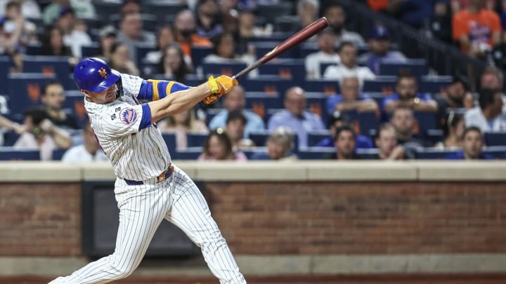 Aug 14, 2024; New York City, New York, USA;  New York Mets first baseman Pete Alonso (20) hits a solo home run in the fourth inning against the Oakland Athletics at Citi Field.