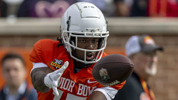 Jan 28, 2025; Mobile, AL, USA; American team wide receiver Jalen Royals of Utah State (17) tracks down a pass during Senior Bowl practice for the American team at Hancock Whitney Stadium. Mandatory Credit: Vasha Hunt-Imagn Images