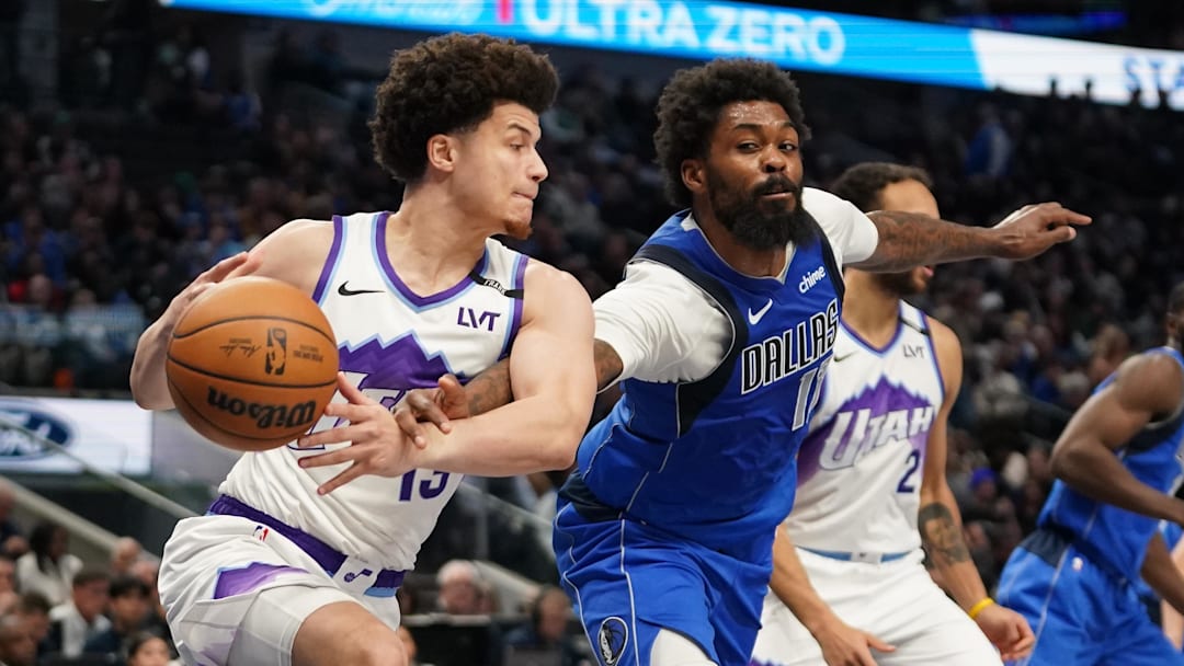 Jan 15, 2026; Dallas, Texas, USA;  Dallas Mavericks forward Naji Marshall (13) makes the steal on Utah Jazz guard Walter Clayton Jr. (13) during the second half at American Airlines Center. Mandatory Credit: Raymond Carlin III-Imagn Images