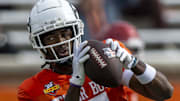 Jan 28, 2025; Mobile, AL, USA; American team wide receiver Jalen Royals of Utah State (17) makes a catch during Senior Bowl practice for the American team at Hancock Whitney Stadium. Mandatory Credit: Vasha Hunt-Imagn Images