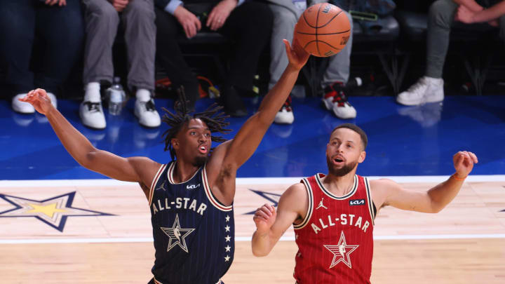 Feb 18, 2024; Indianapolis, Indiana, USA; Eastern Conference guard Tyrese Maxey (0) of the Philadelphia 76ers reaches for a loose ball against Western Conference guard Stephen Curry (30) of the Golden State Warriors during the first quarter in the 73rd NBA All Star game at Gainbridge Fieldhouse. Mandatory Credit: Trevor Ruszkowski-USA TODAY Sports