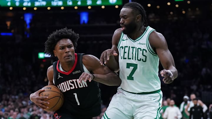 Houston Rockets forward Amen Thompson drives the ball to the basket against Boston Celtics guard Jaylen Brown in the last seconds of then game at TD Garden.
