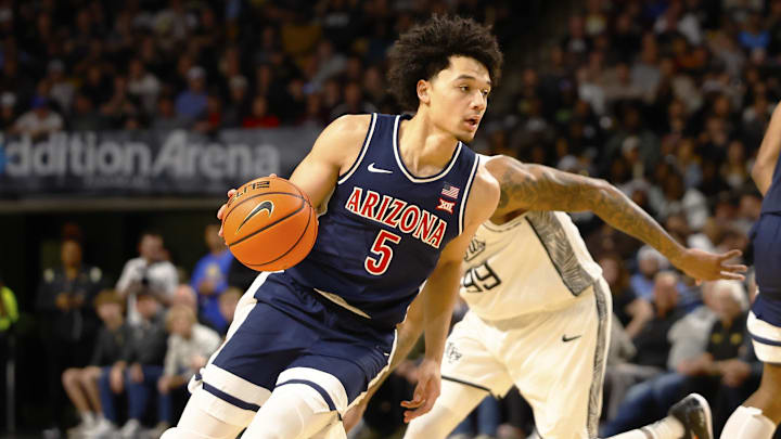 Jan 17, 2026; Orlando, Florida, USA;  Arizona Wildcats guard Brayden Burries (5) drives to the basket in the second half against the Central Florida Knights at Addition Financial Arena. Mandatory Credit: Russell Lansford-Imagn Images