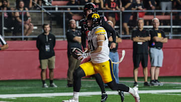 Sep 19, 2025; Piscataway, New Jersey, USA; Iowa Hawkeyes wide receiver Kaden Wetjen (21) returns the opening kickoff for a touchdown during the first quarter against the Rutgers Scarlet Knights at SHI Stadium. Mandatory Credit: Vincent Carchietta-Imagn Images