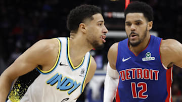 Jan 16, 2025; Detroit, Michigan, USA;  Indiana Pacers guard Tyrese Haliburton (0) dribbles against Detroit Pistons forward Tobias Harris (12) in the second half at Little Caesars Arena. Mandatory Credit: Rick Osentoski-Imagn Images