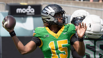 Combat Duck quarterback Akili Smith Jr. drops back to pass during the Oregon Spring Game.