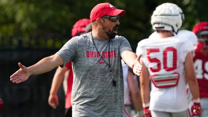 Aug 8, 2024; Columbus, Ohio, USA; Ohio State Buckeyes head coach Ryan Day motions to his team during football practice at the Woody Hayes Athletic Complex.