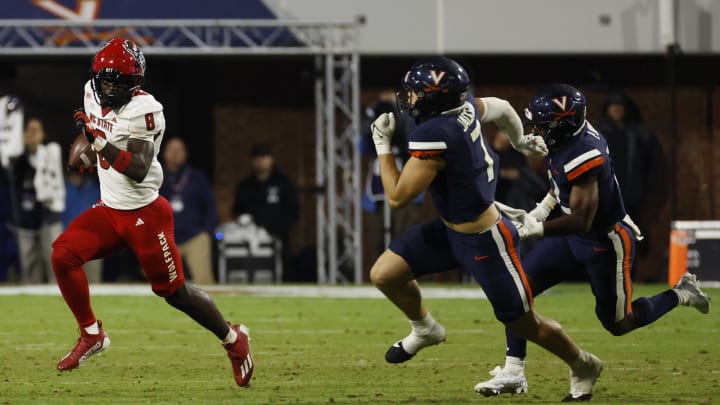Sep 22, 2023; Charlottesville, Virginia, USA;  North Carolina State Wolfpack wide receiver Julian Gray (8) returns a kickoff as Virginia Cavaliers linebacker James Jackson (7) chases during the fourth quarter at Scott Stadium. Mandatory Credit: Geoff Burke-USA TODAY Sports