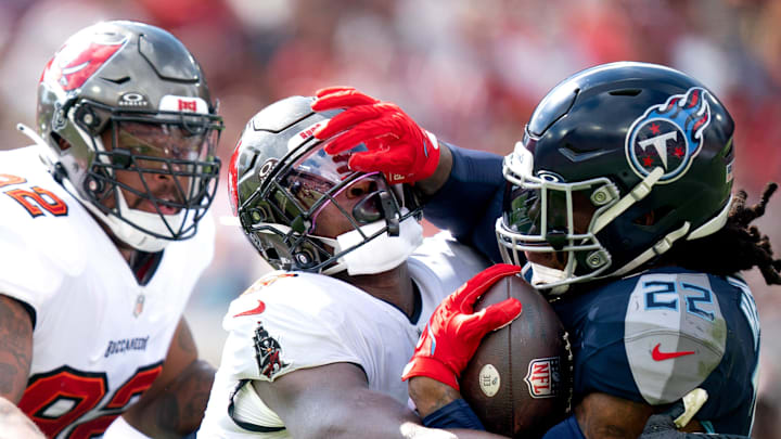 Tampa Bay Buccaneers linebacker Yaya Diaby and Tennessee Titans running back Derrick Henry collide.