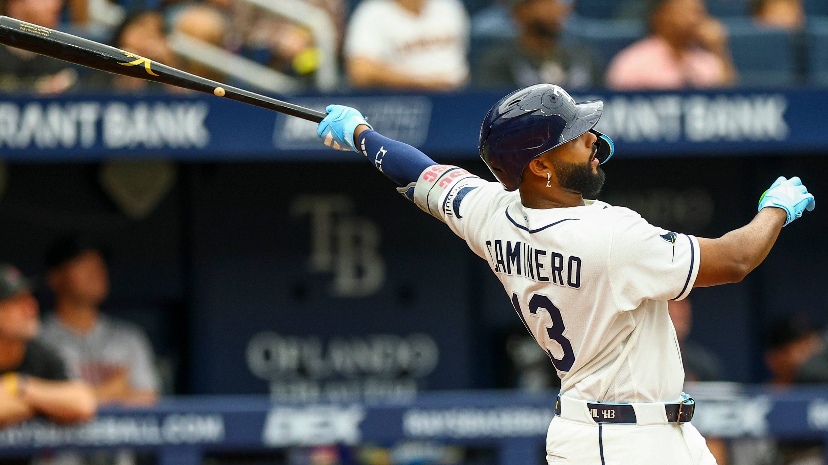 Jun 28, 2026; St. Petersburg, Florida, USA; Tampa Bay Rays third baseman Junior Caminero (13) hits a home run against the Arizona Diamondbacks in the fifth inning at Tropicana Field.