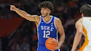 Duke forward Cameron Boozer (12) sends out instructions while guarded by Tennessee forward J.P. Estrella (13) during a college basketball exhibition game between on October 26, 2025, in Knoxville, Tenn.