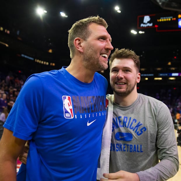 Dallas Mavericks guard Luka Doncic (right) with former player Dirk Nowitzki