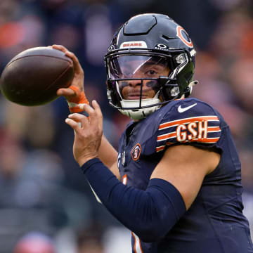 Dec 10, 2023; Chicago, Illinois, USA;  Chicago Bears quarterback Justin Fields (1) passes against the Detroit Lions at Soldier Field. Mandatory Credit: Jamie Sabau-USA TODAY Sports