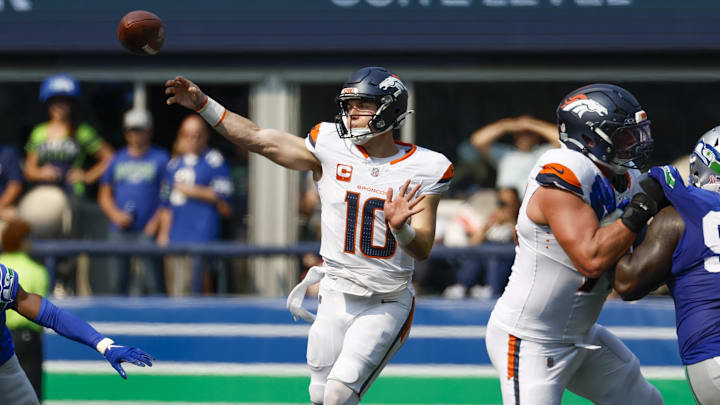 Sep 8, 2024; Seattle, Washington, USA; Denver Broncos quarterback Bo Nix (10) passes against the Seattle Seahawks during the second quarter at Lumen Field. 