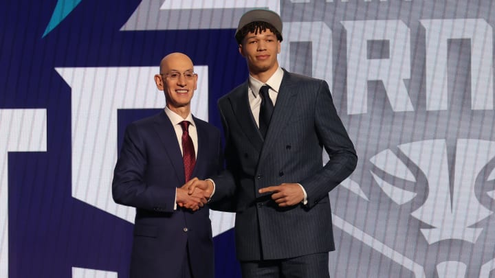 Jun 26, 2024; Brooklyn, NY, USA; Tidjane Salaun poses for photos with NBA commissioner Adam Silver after being selected in the first round by the Charlotte Hornets in the 2024 NBA Draft at Barclays Center. Mandatory Credit: Brad Penner-USA TODAY Sports