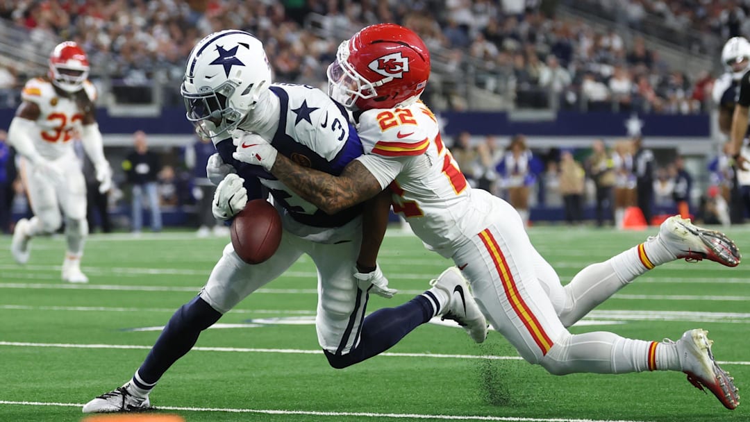 Nov 27, 2025; Arlington, Texas, USA; Kansas City Chiefs cornerback Trent McDuffie (22) forces a fumble from Dallas Cowboys wide receiver George Pickens (3) during the fourth quarter at AT&T Stadium. Mandatory Credit: Kevin Jairaj-Imagn Images