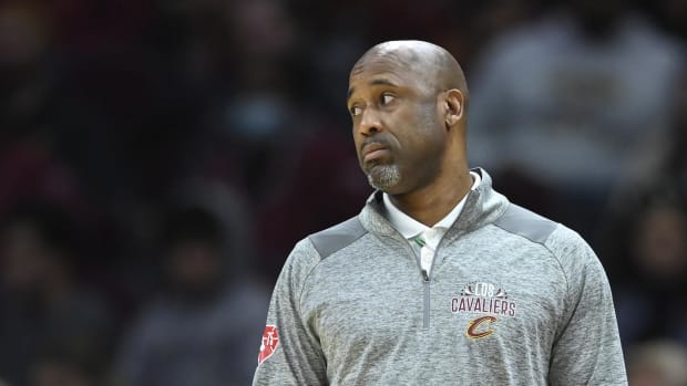 Cleveland Cavaliers assistant coach Greg Buckner reacts in a 2022 regular season game against Charlotte.