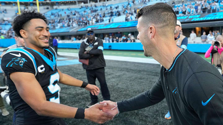 Nov 3, 2024; Charlotte, North Carolina, USA; Carolina Panthers quarterback Bryce Young (9) with head coach Dave Canales after the game at Bank of America Stadium. 
