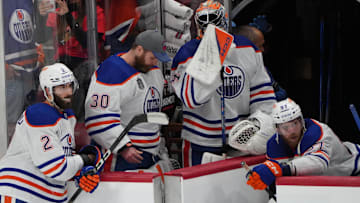 Jun 24, 2024; Sunrise, Florida, USA; Edmonton Oilers forward Connor McDavid (97) and goaltender Calvin Pickard (30) and defenseman Evan Bouchard (2) react to the loss against the Florida Panthers in game seven of the 2024 Stanley Cup Final at Amerant Bank Arena. Mandatory Credit: Jim Rassol-Imagn Images