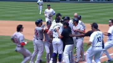 The Colorado Rockies and Boston Red Sox benches clear after an argument between pitcher Cal Quantrill and catcher Reese McGuire.