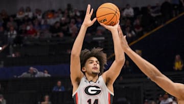 Mar 12, 2025; Nashville, TN, USA;  Georgia Bulldogs forward Asa Newell (14) shoots a three point basket against the Oklahoma Sooners during the first half at Bridgestone Arena.