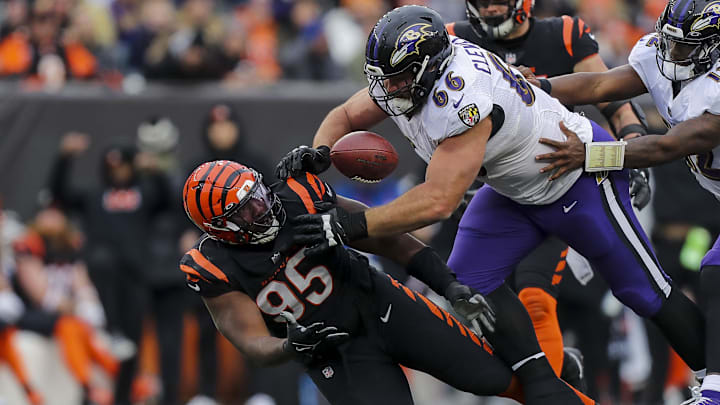 Cincinnati Bengals defensive tackle Zach Carter (95) attempts to catch the tipped ball against Baltimore Ravens guard Ben Cleveland (66) in the second half at Paycor Stadium. 