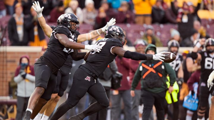 Oct 28, 2023; Minneapolis, Minnesota, USA;  Minnesota Golden Gophers defensive lineman Jah Joyner (17) celebrates his strip-sack and fumble recovery against the Michigan State Spartans with defensive lineman Jalen Logan-Redding (97) during the fourth quarter at Huntington Bank Stadium.