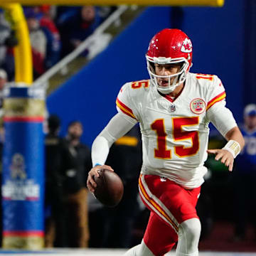Kansas City Chiefs’ quarterback Patrick Mahomes (15) and Buffalo Bills defensive end Greg Rousseau (50).