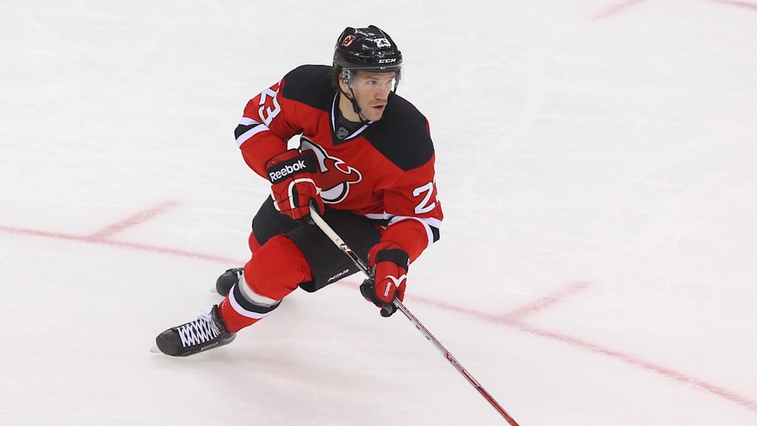 Nov 14, 2015; Newark, NJ, USA; New Jersey Devils right wing Bobby Farnham (23) skates with the puck during the third period against the Pittsburgh Penguins at Prudential Center.  The Devils defeated the Penguins 4-0.  Mandatory Credit: Ed Mulholland-Imagn Images