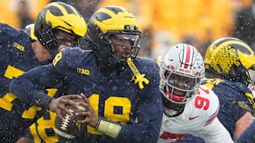 Ohio State Buckeyes defensive end Kenyatta Jackson Jr. (97) sacks Michigan Wolverines quarterback Bryce Underwood (19) during the NCAA football game at Michigan Stadium in Ann Arbor, Mich. on Nov. 29, 2025. Ohio State won 27-9.