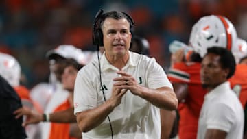Sep 13, 2025; Miami Gardens, Florida, USA; Miami Hurricanes head coach Mario Cristobal call a timeout against the South Florida Bulls during the fourth quarter  at Hard Rock Stadium. Mandatory Credit: Sam Navarro-Imagn Images