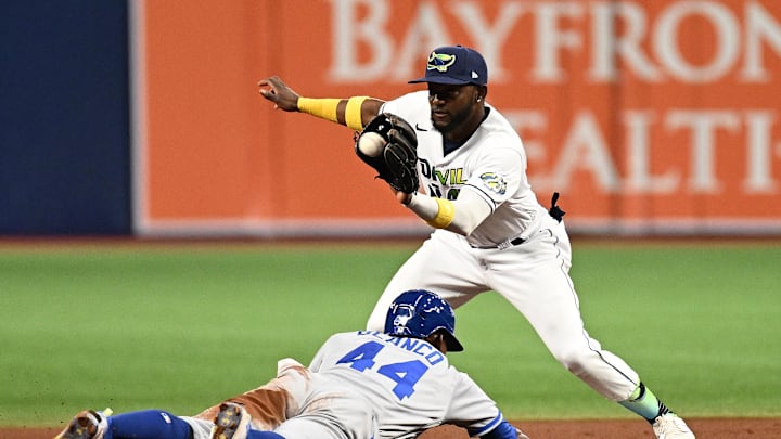 Jun 23, 2023; St. Petersburg, Florida, USA; Tampa Bay Rays second baseman Vidal Brujan (7) waits for the ball as Kansas City Royals left fielder Dairon Blanco (44) slides into second base in the fifth inning at Tropicana Field. Mandatory Credit: Jonathan Dyer-Imagn Images