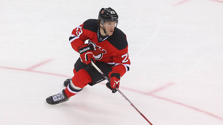 Nov 14, 2015; Newark, NJ, USA; New Jersey Devils right wing Bobby Farnham (23) skates with the puck during the third period against the Pittsburgh Penguins at Prudential Center.  The Devils defeated the Penguins 4-0.  Mandatory Credit: Ed Mulholland-Imagn Images