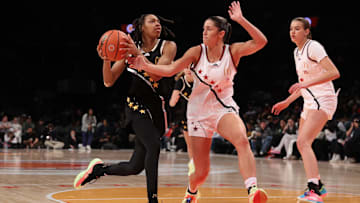 Apr 1, 2025; Brooklyn, NY, USA; McDonald's All American East wing Nyla Brooks (7) drives to the basket against McDonald's All American West guard Addie Deal (7) during the second half of the game at Barclays Center. Mandatory Credit: Pamela Smith-Imagn Images