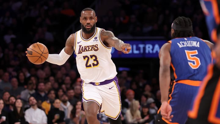 Feb 3, 2024; New York, New York, USA; Los Angeles Lakers forward LeBron James (23) brings the ball up court against New York Knicks forward Precious Achiuwa (5) during the second quarter at Madison Square Garden. Mandatory Credit: Brad Penner-USA TODAY Sports