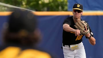 May 20, 2025; Hoover, AL, USA; Missouri shortstop 	Jackson Lovich throws to first for an out against Alabama in the first game of the SEC Baseball Tournament at the Hoover Met.